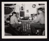 Shipboard Life. Men possibly in mail room